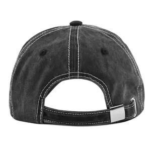Detail view of washed black vintage baseball cap with white contrast stitching and metal buckle
