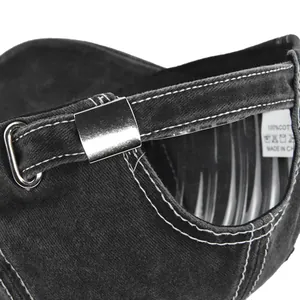 Close-up of vintage washed denim baseball cap back with metal buckle and contrast stitching