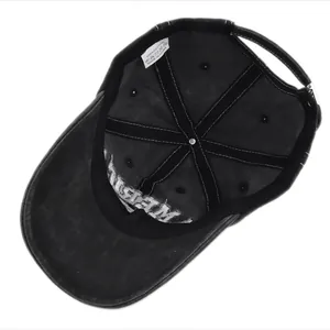 Detail of internal six-panel structure and 100% cotton label on vintage black baseball cap