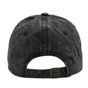 Detail of vintage washed baseball cap featuring adjustable antique brass metal buckle