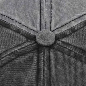 Close-up of the vintage washed cotton baseball cap crown with button and stitching
