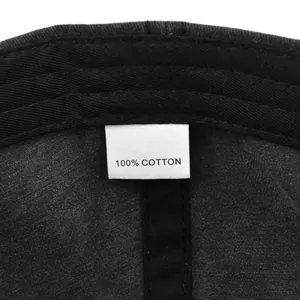 Detail view of the 100% cotton label and internal stitching on the vintage baseball cap