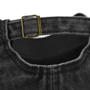 Detail of adjustable brass buckle and vintage washed gray denim on baseball cap back