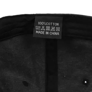 Detail of 100% cotton inner sweatband and wash label on the black baseball cap