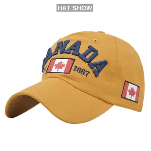 Close-up of high-quality blue CANADA 3D embroidery on a vibrant yellow cotton baseball cap