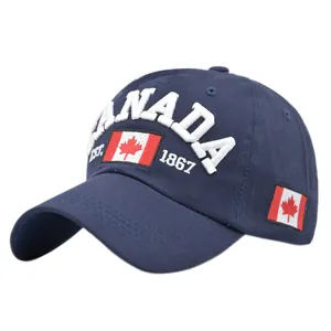 Detail showing white Canada embroidery and red maple leaf on navy cotton baseball cap