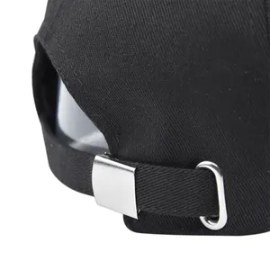 Detail of adjustable metal buckle on black cotton baseball cap with maple embroidery