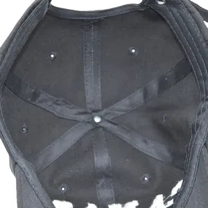Detail of internal black cotton twill structure and reinforced seams of baseball cap