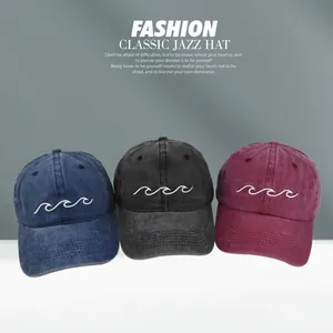Three vintage washed cotton baseball caps in navy, black and burgundy with wave embroidery