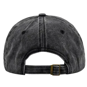 Macro detail of washed vintage baseball cap showing the metal buckle and fabric texture