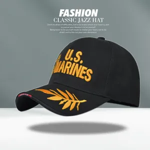 Detailed macro view of yellow U.S. MARINES embroidery on durable black cotton baseball cap