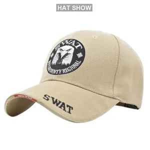 Close-up of khaki tactical cap with detailed eagle embroidery and SWAT brim stitching