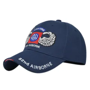 Macro view of detailed 82nd Airborne embroidery on navy blue tactical baseball cap