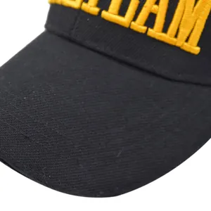 Detail of yellow 3D embroidery on black cotton twill tactical baseball cap