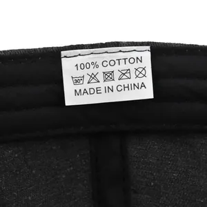 Close-up of 100% cotton fabric interior and wash care label on a vintage baseball cap
