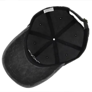 Detail view of the washed cotton baseball cap interior with sweatband and cotton label