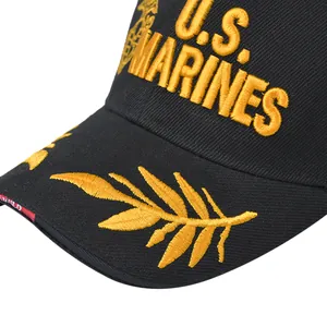 Macro shot of gold 3D embroidery and U.S. Marines logo on black baseball cap