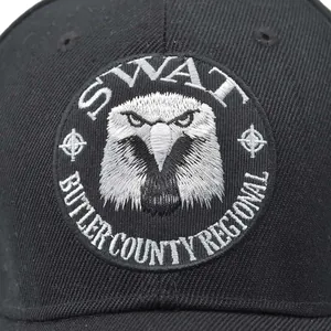 Tactical SWAT baseball cap in black with detailed eagle embroidery and regional badge