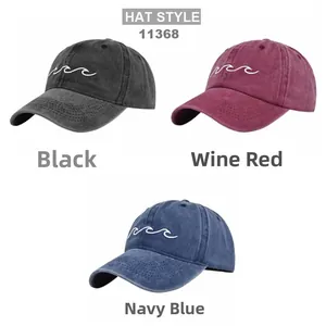 Detailed view of wave embroidery on vintage washed cotton baseball caps in three colors