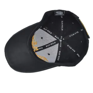 Detailed interior of black baseball cap showing reinforced seams and yellow embroidery