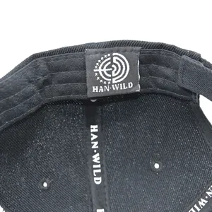 Detailed interior of tactical baseball cap showing HAN WILD brand label and seam stitching