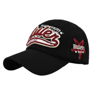 Macro shot of 3D embroidery on black cotton baseball cap showing detailed Ruler stitching