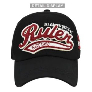 Detail of red towel embroidery and Ruler 3D stitching on black cotton baseball cap