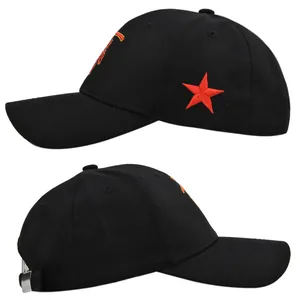 Detail of black cotton baseball cap featuring red star embroidery and metal buckle closure
