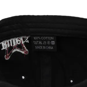 Detail of 100% cotton baseball cap interior showing quality stitching and washing label