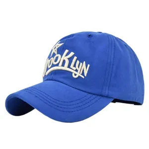 Detail of 3D embroidery showing Brooklyn text and star on navy blue cotton baseball cap