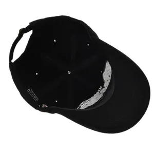 Detailed interior of a 100% cotton baseball cap showing adjustable metal buckle and label