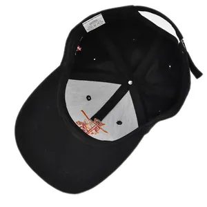 Detail view of cotton baseball cap interior showing 100% cotton label and neat stitching