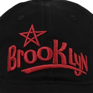 Black cotton baseball cap featuring detailed 3D red Brooklyn embroidery with a star