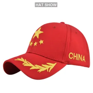 Close-up of China star embroidery and wheat ear pattern on a red cotton baseball cap