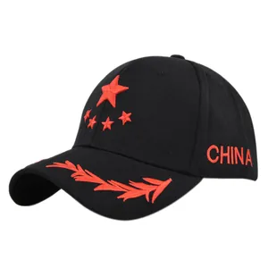 Detail of red pentagram embroidery and CHINA text on a black cotton baseball cap
