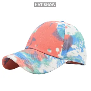Detail view of colorful tie-dye baseball cap featuring a vibrant distressed artistic pattern