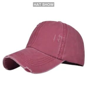 Detail of distressed ponytail baseball cap with vintage washed texture and torn fabric