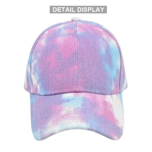 Close-up of pink and blue tie-dye canvas fabric and stitching on a ponytail baseball cap
