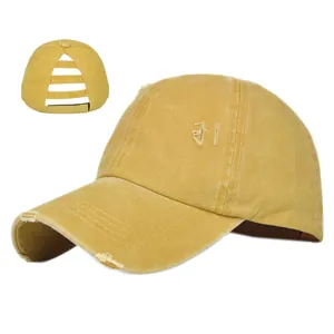 Detailed view of ginger ponytail hole baseball cap with distressed washed cotton texture