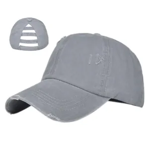 Detail of grey washed ponytail baseball cap with distressed brim and triple rear openings