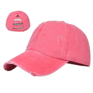 Close-up of pink distressed ponytail baseball cap with elastic criss-cross back detail