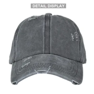 Detail shot of distressed ponytail baseball cap in charcoal cotton with vintage torn holes