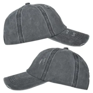 Detail view of washed dark grey ponytail baseball cap with distressed vintage ripped finish
