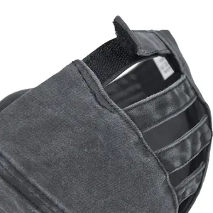 Close-up of distressed charcoal ponytail baseball cap with elastic bands and Velcro closure