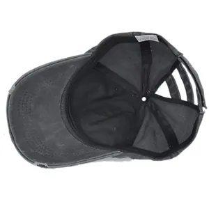 Detail view of washed cotton baseball cap interior with sweatband and sewing