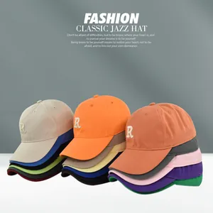 Close-up of baseball caps with 3D letter R embroidery in multiple vibrant color options
