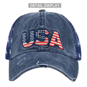 Detail of vintage washed blue trucker hat with USA flag embroidery and mesh back
