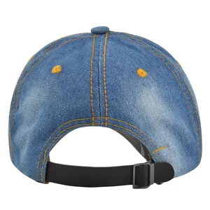 Detail of denim baseball cap showing leather adjustable strap and metal buckle closure