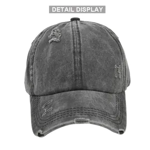 Vue détaillée de la casquette délavée gris anthracite avec effet usé et trou pour queue de cheval