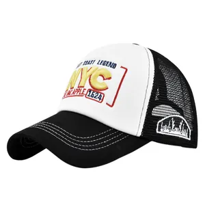 Detail of 3D NYC embroidery and mountain patch on black and white mesh trucker cap